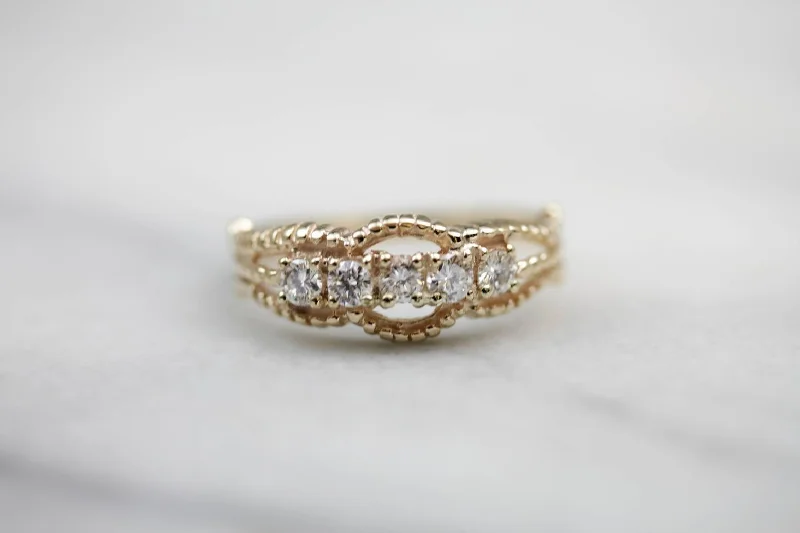 Women’s large diamond engagement ring-Five Diamond Gold Ring with Twist Details