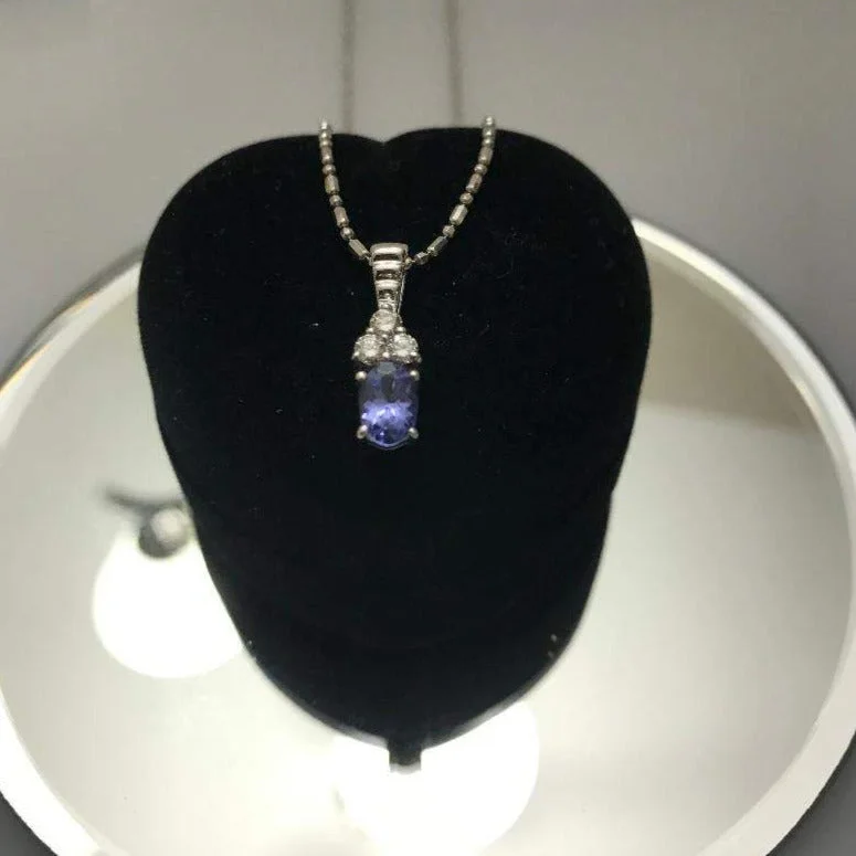 Women’s fashion statement necklace-14 Karat White Gold Diamond And Tanzanite Pendant