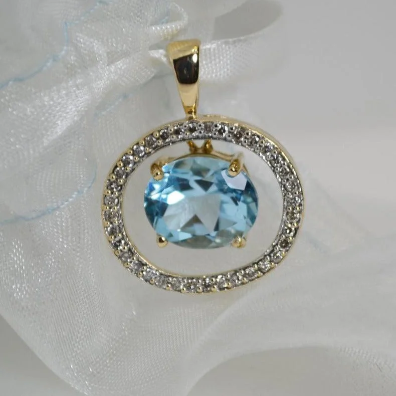 Women’s silver necklace-10 Karat Yellow Gold Blue Topaz And Diamond Pendant