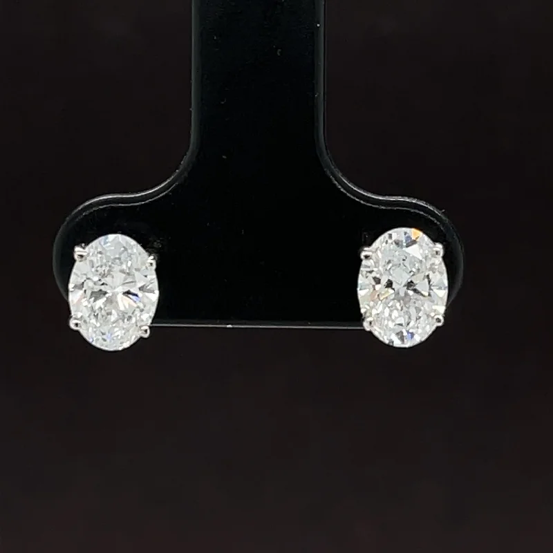 Women’s high-fashion earrings-1 1/2ctw  E-F/VS Lab Grown Diamond Oval Solitaire Stud Earrings in 18k White Gold - IGI Certified - #253 - OV 150W18R100