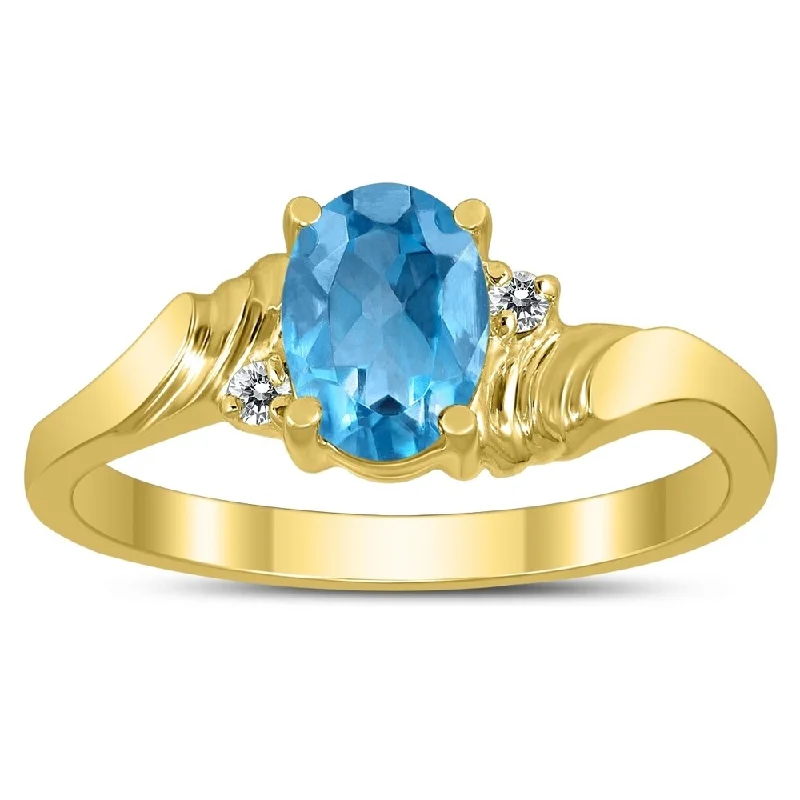 Women’s chunky ring-7X5MM Blue Topaz and Diamond Wave Ring in 10K Yellow Gold