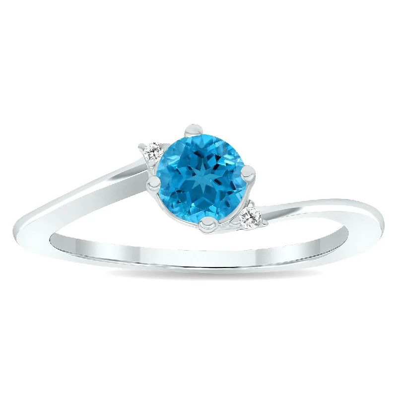 Women’s eternity ring-Women's Blue Topaz and Diamond Wave Ring in 10K White Gold