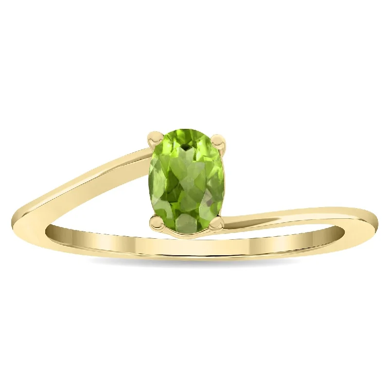 Women’s wedding ring-Women's Solitaire Oval Shaped Peridot Wave Ring in 10K Yellow Gold