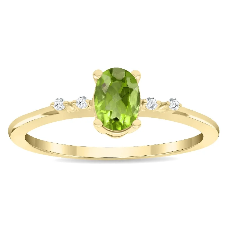 Women’s sparkly ring-Women's Oval Shaped Peridot and Diamond Sparkle Ring in 10K Yellow Gold