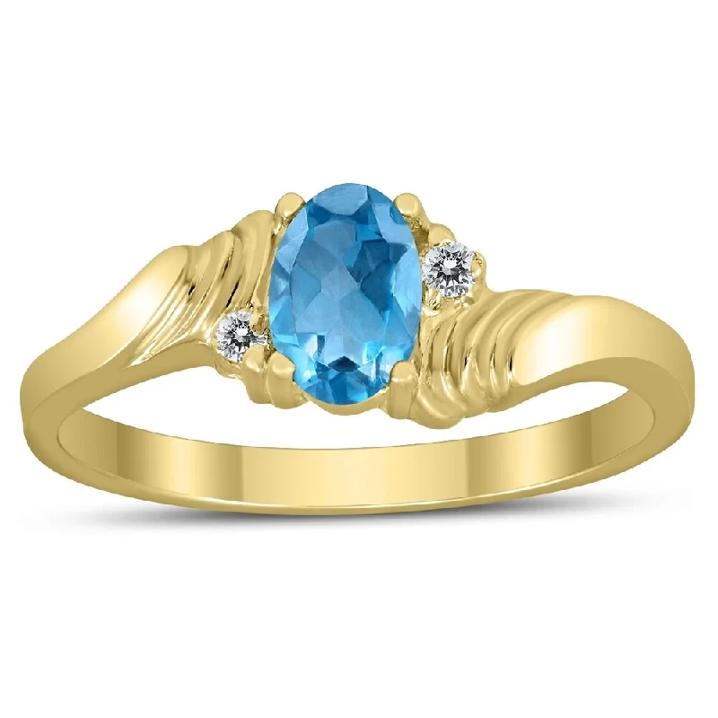 Women’s anniversary ring-6X4MM Blue Topaz and Diamond Wave Ring in 10K Yellow Gold