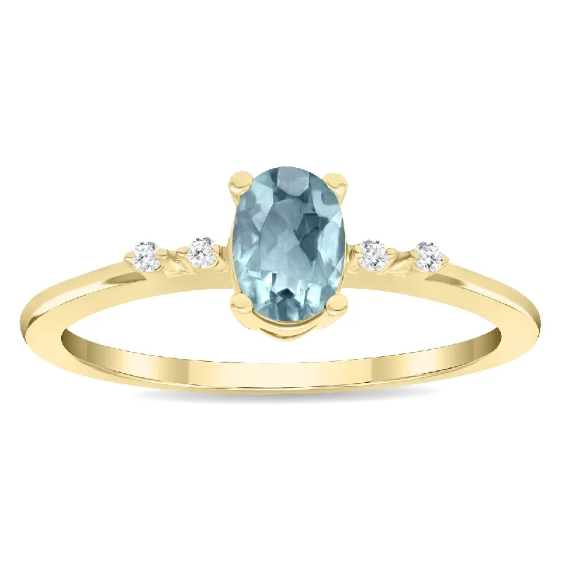 Women’s double band ring-Women's Oval Shaped Aquamarine and Diamond Sparkle Ring in 10K Yellow Gold