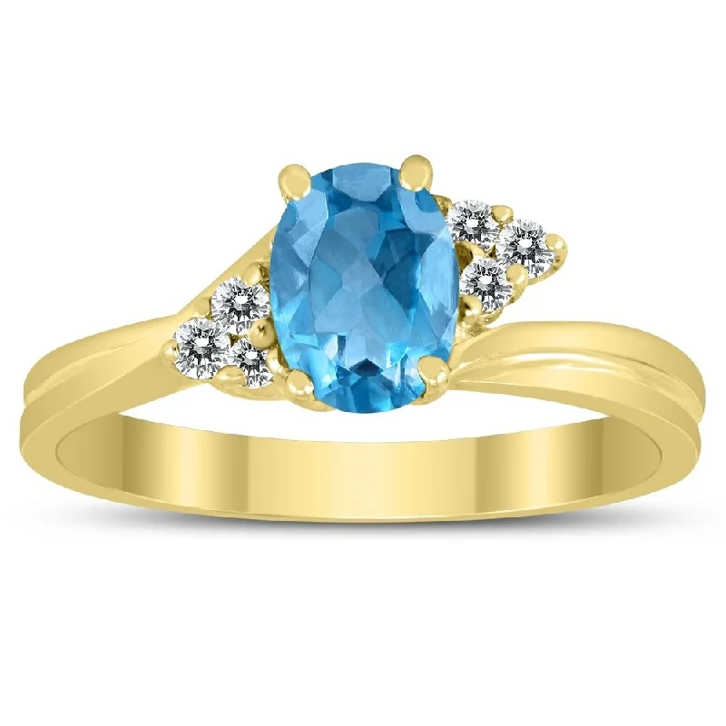 Women’s round diamond ring-7X5MM Blue Topaz and Diamond Twist Ring in 10K Yellow Gold