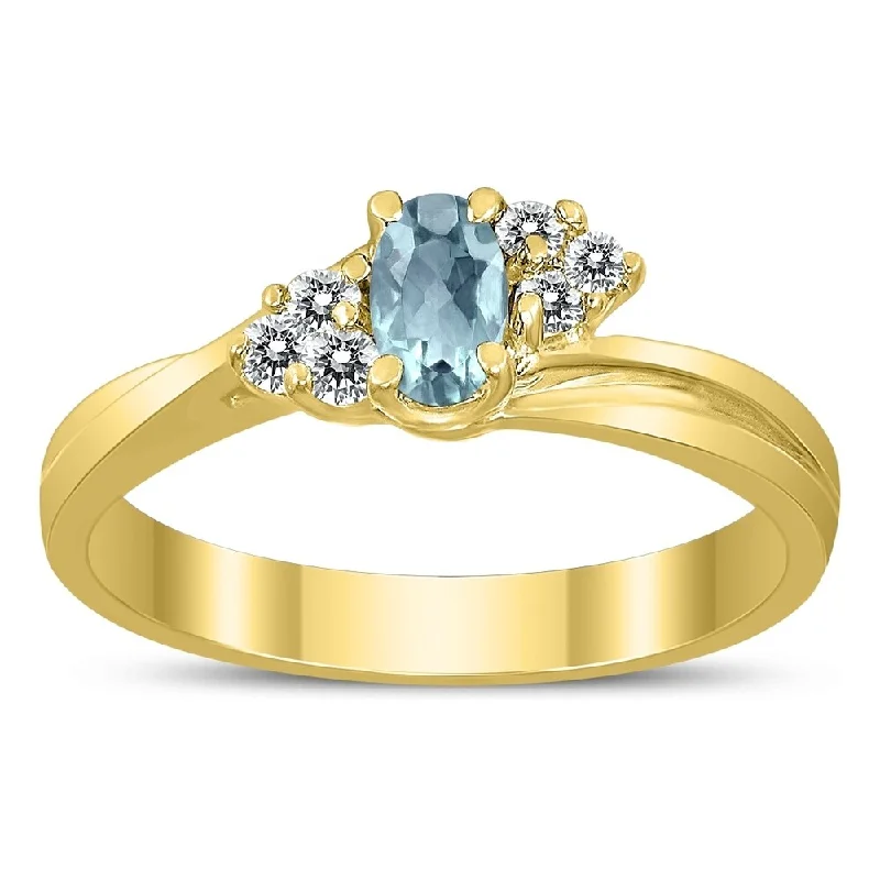 Women’s diamond eternity ring-5X3MM Aquamarine and Diamond Twist Ring in 10K Yellow Gold