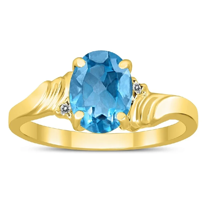 Women’s art nouveau ring-8X6MM Blue Topaz and Diamond Wave Ring in 10K Yellow Gold